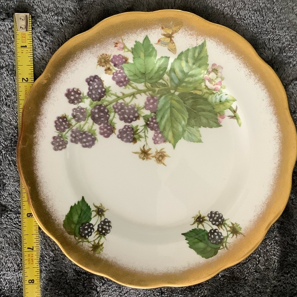 Vintage-Inspired Gold and White Plate with Berry Design